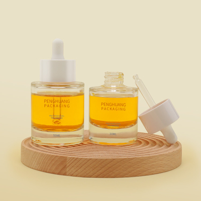 Il contagoccia di vetro del siero dell'olio dell'OEM 1oz imbottiglia la spalla piana 50ml