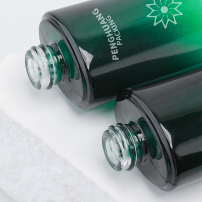 la bottiglia della lozione di vetro di bellezza 55ml ha glassato la lozione che il regalo cosmetico della bottiglia ha fissato il verde d'imballaggio di Skincare