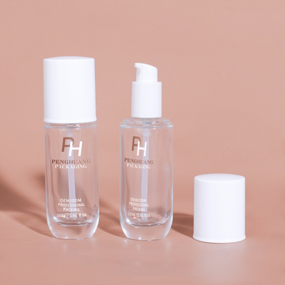 Forma rotonda Chiara Bottella di fondazione liquida vuota 30 ml 1 oz Bottiglia pompa di lozione di vetro Per imballaggi cosmetici