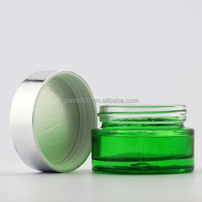 Il vetro crema verde vuoto stona 5g-100g con il coperchio d'argento per il cosmetico