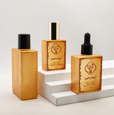 Bottiglia di vetro su misura del contagoccia dell'olio essenziale dell'olio 30ml 50ml 100ml dell'oro del siero di lusso vuoto cosmetico del quadrato