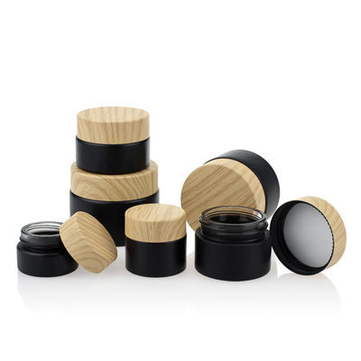 Il nero di bambù d'imballaggio cosmetico Matte Glass Jars 50g del coperchio a vite di colore dell'insieme