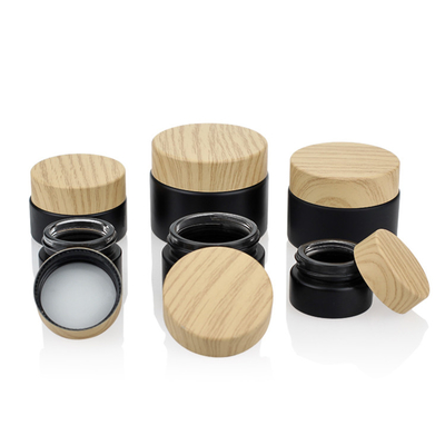 Il nero di bambù d'imballaggio cosmetico Matte Glass Jars 50g del coperchio a vite di colore dell'insieme