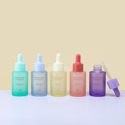 Il contagoccia di vetro d'imballaggio glassato dell'olio essenziale del siero del cosmetico di vetro variopinto della bottiglia imbottiglia 30ml