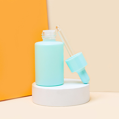 Gli azzurri colorano il contagoccia di vetro del siero imbottigliano l'olio per capelli che imballa 30ml