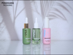 Il contagoccia operato di vetro stampato del siero 1oz imbottiglia per l'imballaggio cosmetico